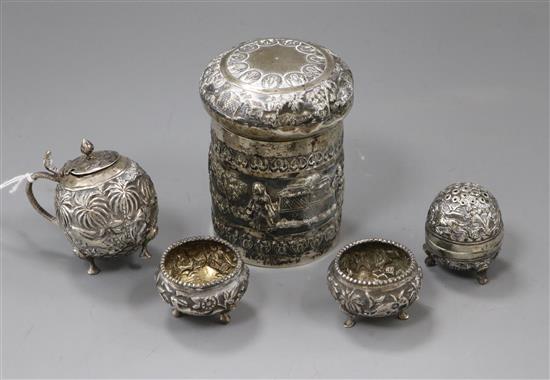 An Indian white metal jar and cover and four cruets.